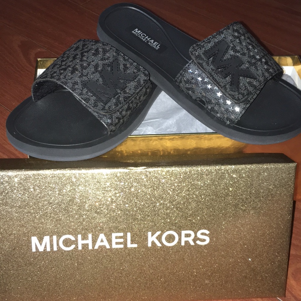 Black and silver Michael Kors slides